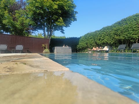 Seasonal outdoor pool, open 10:00 AM to 8:00 PM, sun loungers