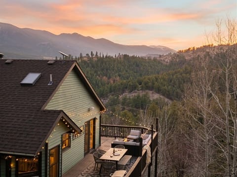 Soak in serene mountain sunsets from the expansive wrap around balcony!