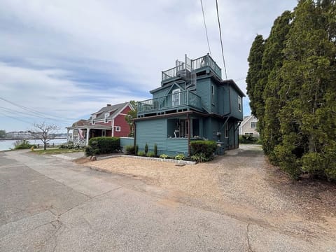 Coastal retreat with rooftop deck, water access, and off-street parking