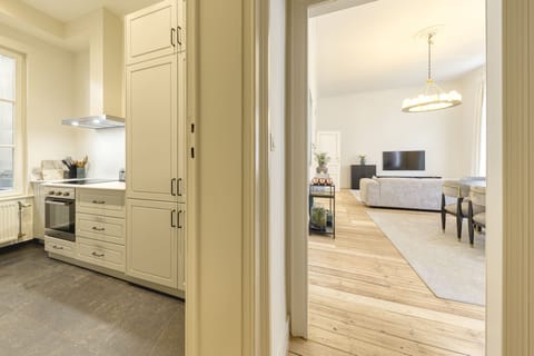 Luxury Apartment | Living area | 100-cm Smart TV with satellite channels, fireplace, Netflix