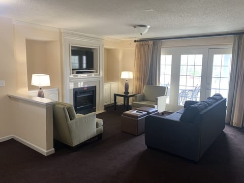 Two living rooms with a pull-out sofa sleeper and cozy fireplace