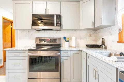 Kitchen with stainless steel appliances view 1