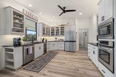 Spacious kitchen fully stocked with all the amenities of home including pots/pans, air fryer, crock pot, etc.