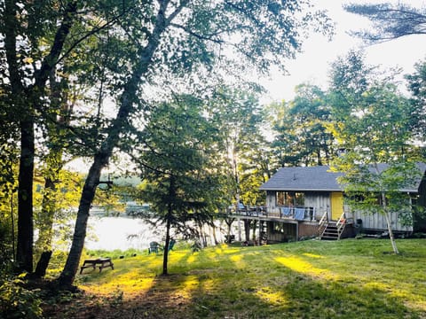 The view of the camp from the road. Spacious yard right on the water! 