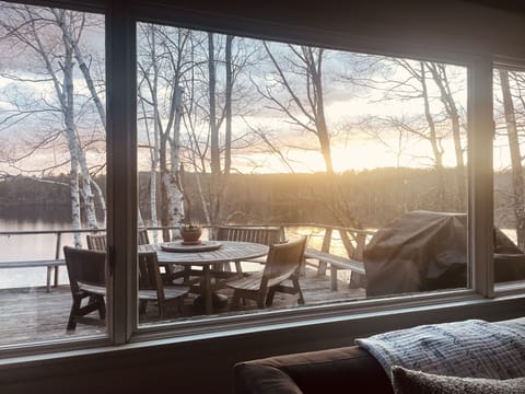 Winter view from the living space of the deck and pond.