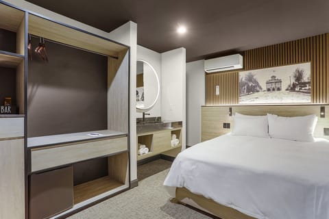 Economy Room | Down comforters, in-room safe, iron/ironing board, free WiFi