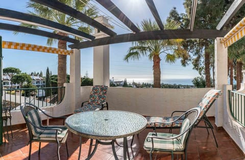 Large patio with sea and golf course views.