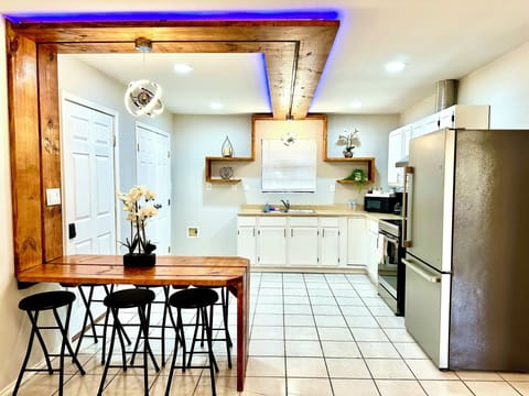 Modern kitchen with led lights that can change color, you decide the mood.