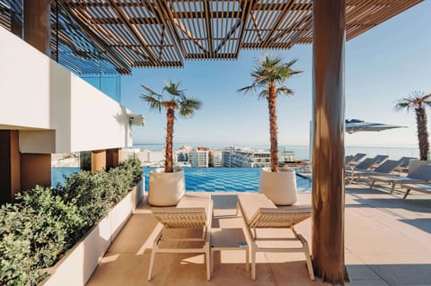 Indoor pool, outdoor pool, pool umbrellas, sun loungers