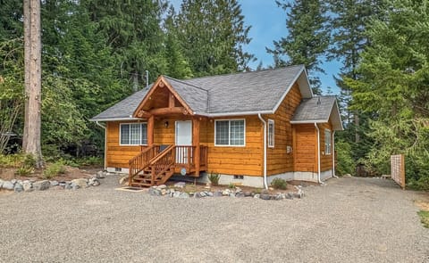 Cedar wrapped cabin with large driveway