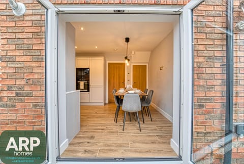 Seamless indoor-outdoor living — dine with stunning patio views.