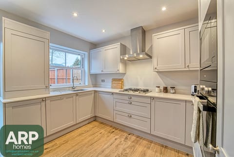 Modern kitchen fully equipped for home-cooked meals and gatherings.