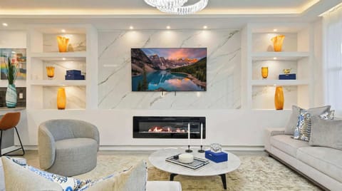 Luxurious modern retreat with elegant décor, a cozy fireplace, and stylish touches.