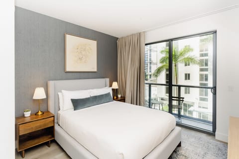 Queen Bed, with extra bed linens, extra pillows, extra blankets, and room-darkening shades