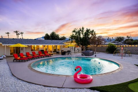 Backyard at sunset w/ floaties & string lights