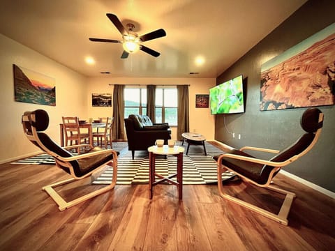 Beautifully remodeled living area with comfortable seating, mountain-inspired art, and space to unwind.