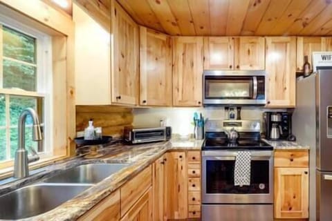 Kitchen equipped with coffee maker, air fryer, microwave, and dishwasher