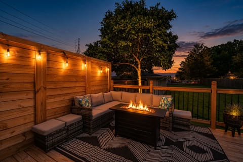 Gather around the fire pit and string lights on the outdoor sectional once the sun goes down