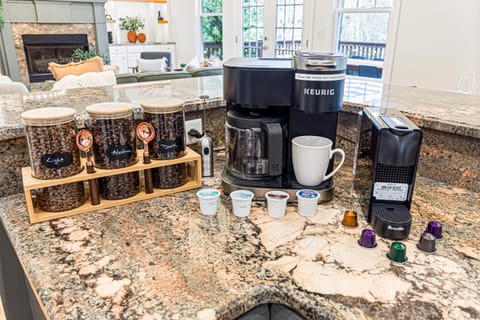 Discover a variety of options at our coffee bar! Our two-in-one Keurig accepts both K-cups and ground coffee. Choose from 3 coffee bean types, and enjoy a starter pack of K-cups. Don't miss our Nespresso mini for an added touch of elegance!