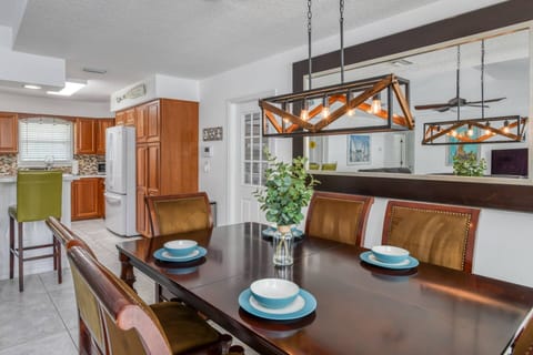 The dining table has plenty of space to share a meal together.