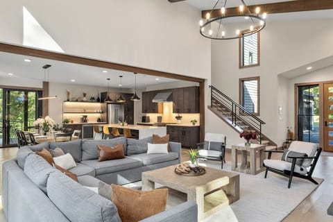 Great Room – Natural light, designer seating, and seamless flow to kitchen and dining.