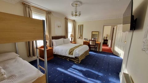 Family Connecting Room | Desk, iron/ironing board, bed sheets