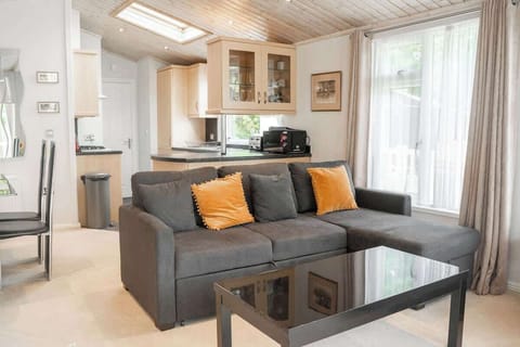 The Open Plan Living Space: relax on the comfortable sofa in the lodge's living space, this large sofa also converts into a bed (please request linen on booking).