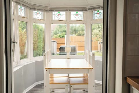 The Dining Space:  gather round the dining table in the eating space by the bright bay window.