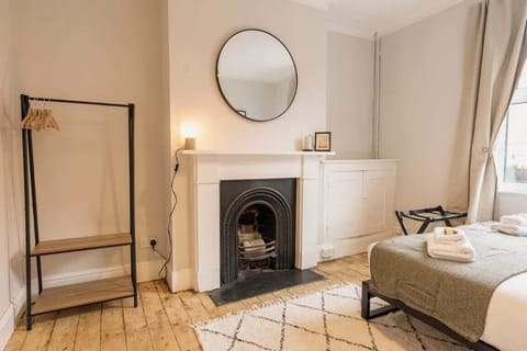 Downstairs Double Bedroom: Bedroom 1:  this spacious bedroom has a feature fireplace, adding character to the room.