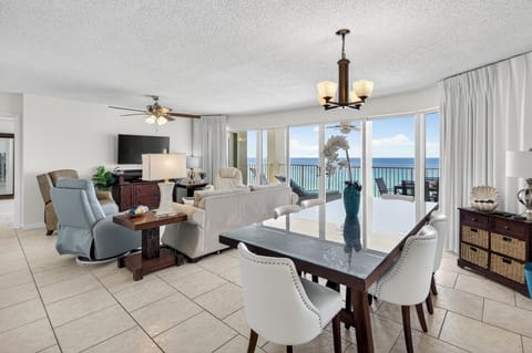 Living Room/Dining Room combo with floor to ceiling views of the Gulf and Beach.