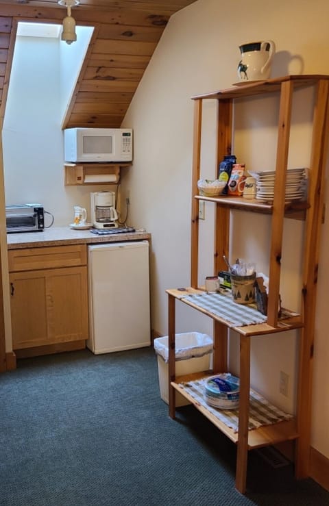Kitchenette in 3rd bedroom with microwave, toaster oven, coffee maker & fridge