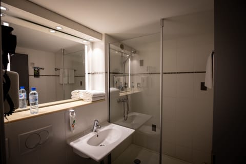 Shower, eco-friendly toiletries, hair dryer, towels