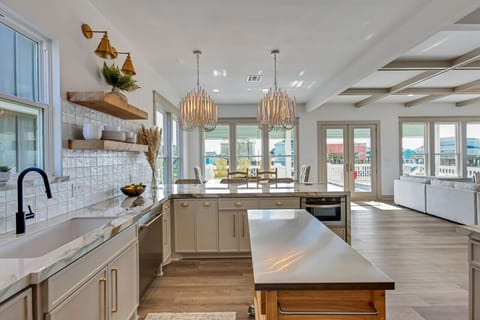 Prepare to be dazzled by the elegance of our kitchen island, where culinary dreams come to life against the backdrop of Tilda driftwood chandeliers