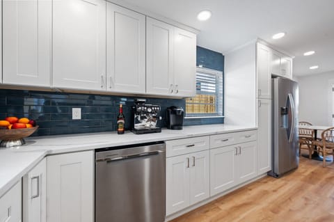 Open kitchen with chef cookware and new appliances