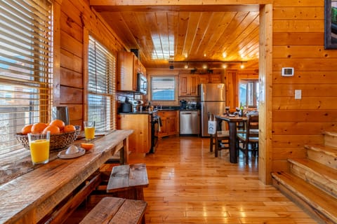 Living room leads to the dining area and kitchen.