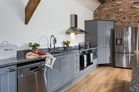 Two electric ovens and two dishwashers are located in the kitchen area
