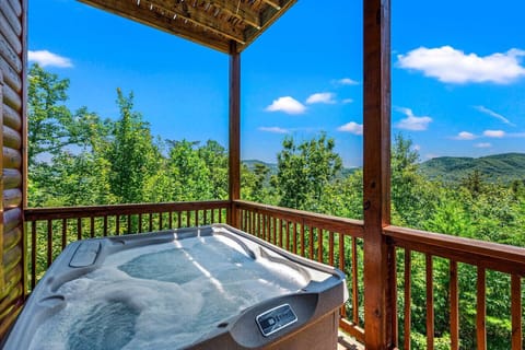 The hot tub is located on the back deck with stunning mountain views