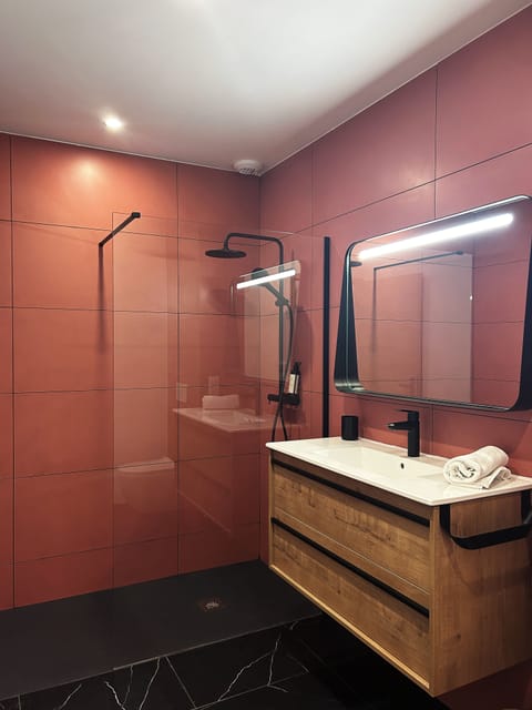 Shower, rainfall showerhead, hair dryer, towels