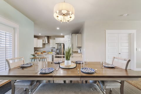 Kitchen in the back, balcony to the left, family room and bedroom to the right.