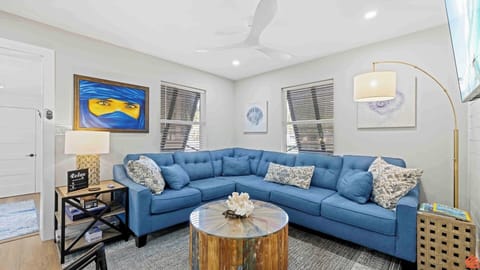 A cozy living room with plush furniture, soft lighting, and tasteful decor invites relaxation and warm conversations.