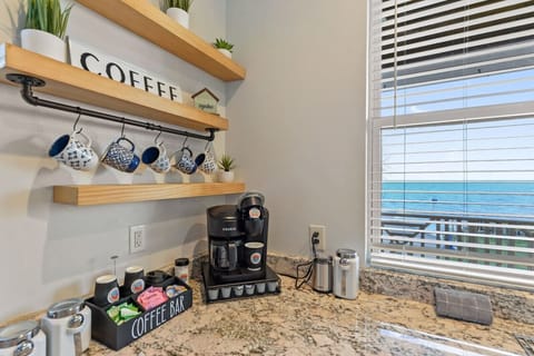 Fully stocked coffee bar, with k-cups, whole bean coffee, coffee grinder creamers, sweeteners and more!