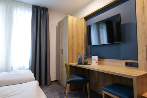 Comfort Double Room | Living area | TV