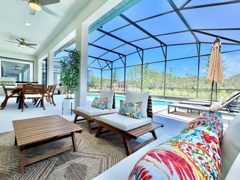 Welcome to the large pool space with Summer Kitchen