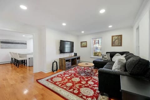 Cozy living room nestled between the oversized kitchen and four-season porch.