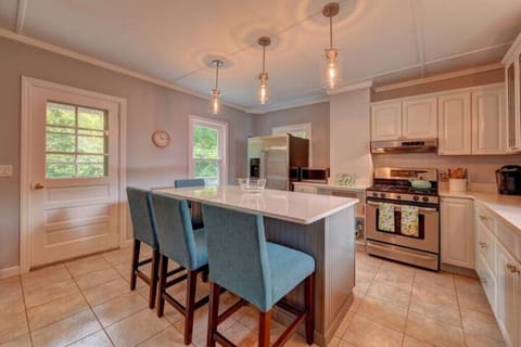 Well-appointed kitchen with an oversized island that seats four people.