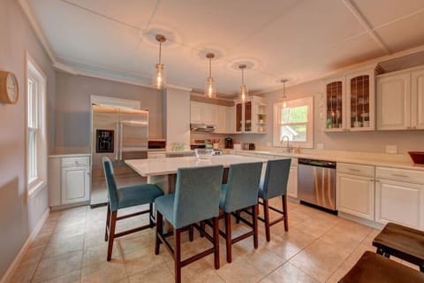 Well-appointed kitchen with an oversized island that seats four people.