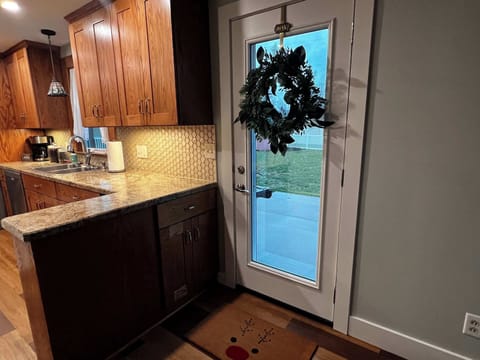 Exit from dining room to back yard and patio area. 