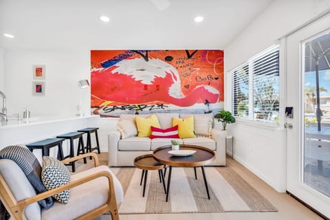 Open concept Living Room with plenty of sunlight streaming through.
