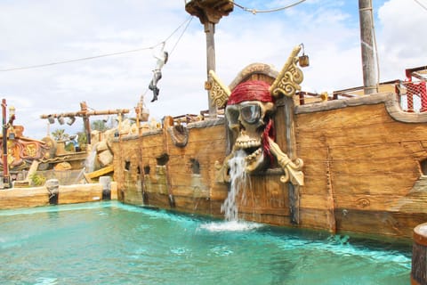 Pirate ship attraction with interactive water elements, creating a thrilling experience for all ages.