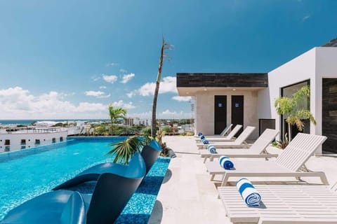 Soak up the sun! Our rooftop pool & lounge await.